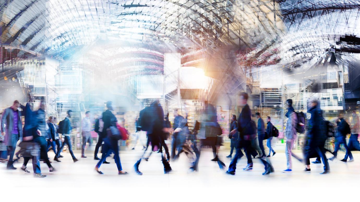 Motion blur picture of people moving in a train station