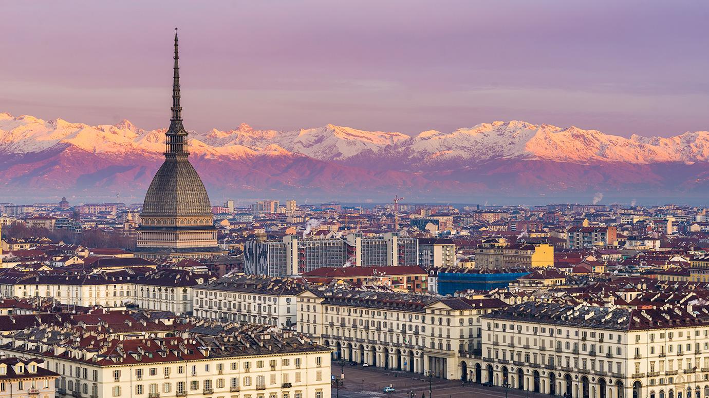 Torino (Turin, Italy): cityscape at sunrise with details of the Mole Antonelliana towering over the city.