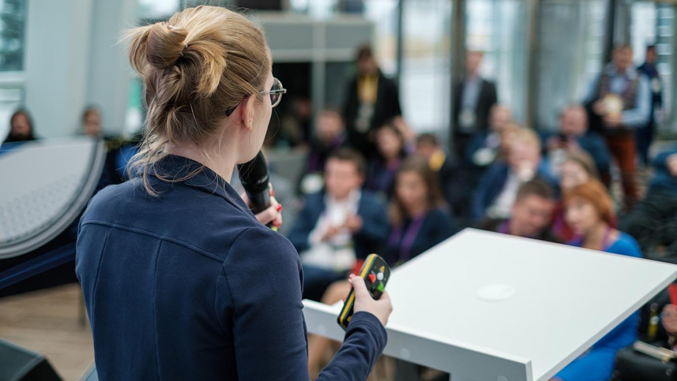 Speaker making a pitch on the podium