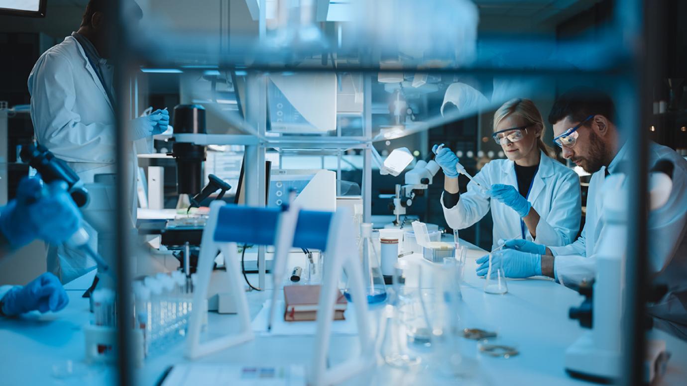 Scientists in a lab testing some liquids