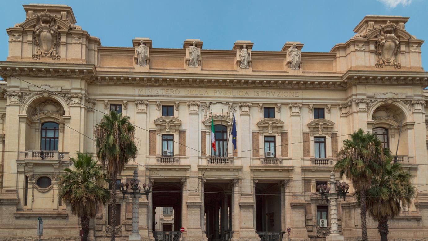 talian government ministry facade with flags. Exterior view of The Ministry of Education, University & Research